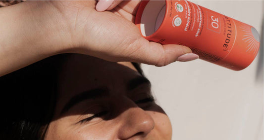 Woman Applying Sunscreen to Prevent Dry Skin after Winter Sports